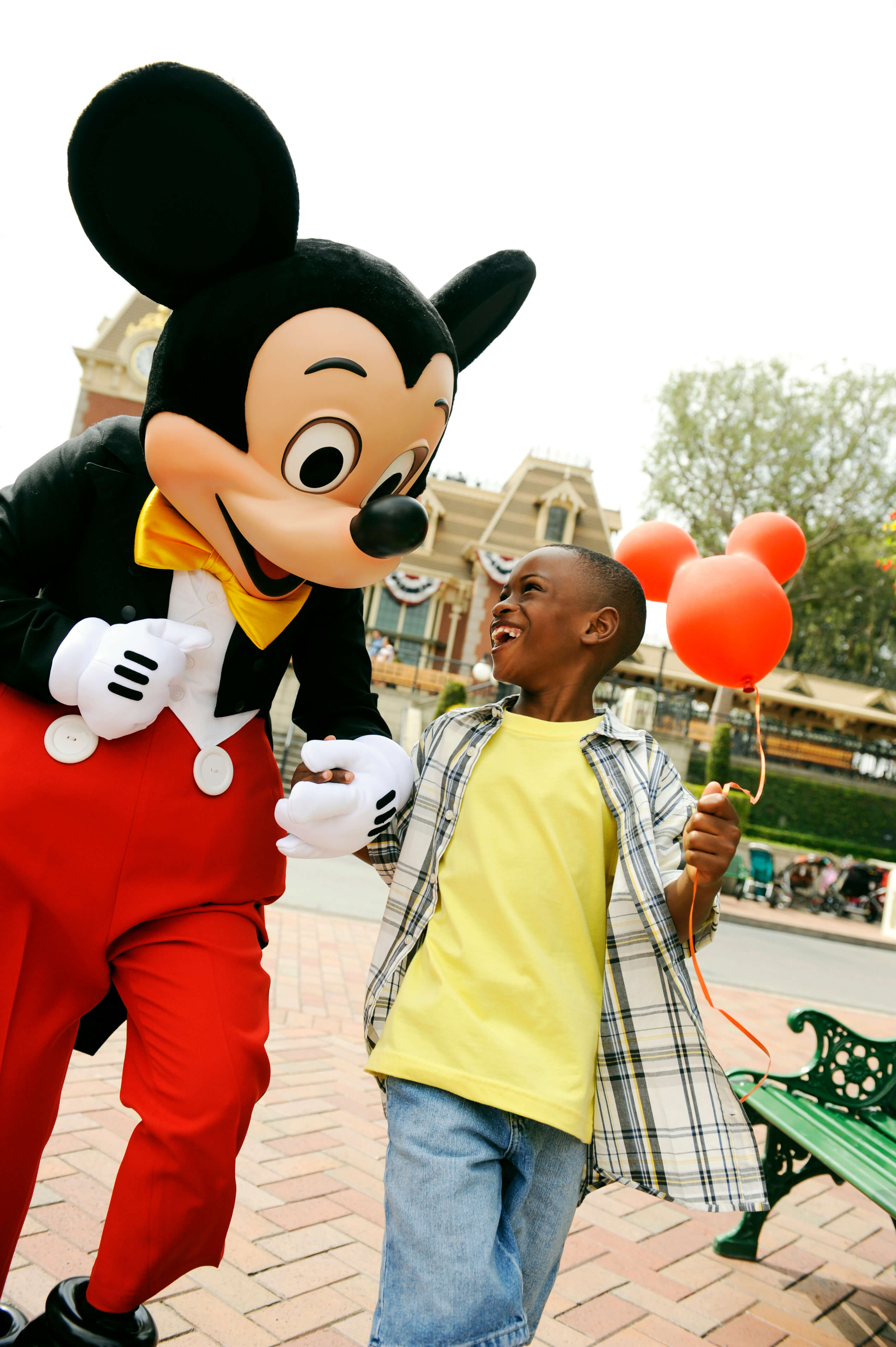 mickey & boy with balloon at Disney World